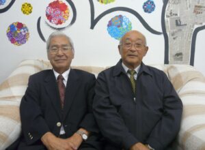 （左から）水本理事、根岸会長